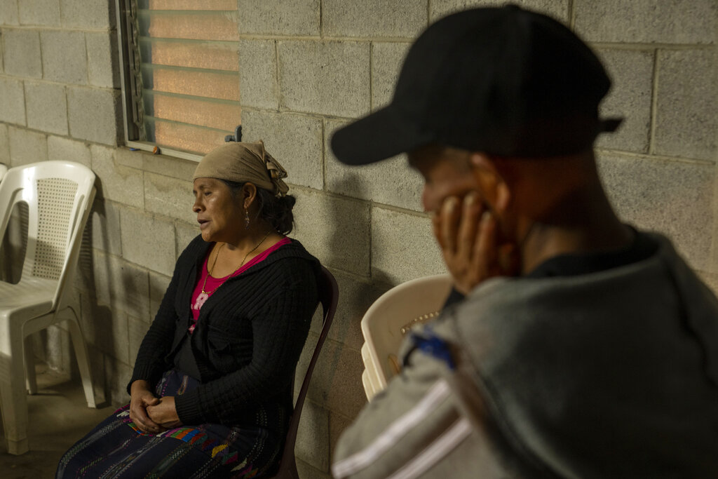 Magdalena Tepaz, left, and Manuel de Jesus Tulul parents of Wilmer Tulul, talks with reporters in Tzucubal, Guatemala, Wednesday, June 29, 2022. Tzucubal is the hometown of Pascual Melvin Guachiac and Wilmer Tulul, both 13, who were among the dead discovered inside a tractor-trailer on the edge of San Antonio, Texas, on Monday, in one of the nation's deadliest smuggling episode on the U.S.-Mexico border. (AP Photo/Moises Castillo)