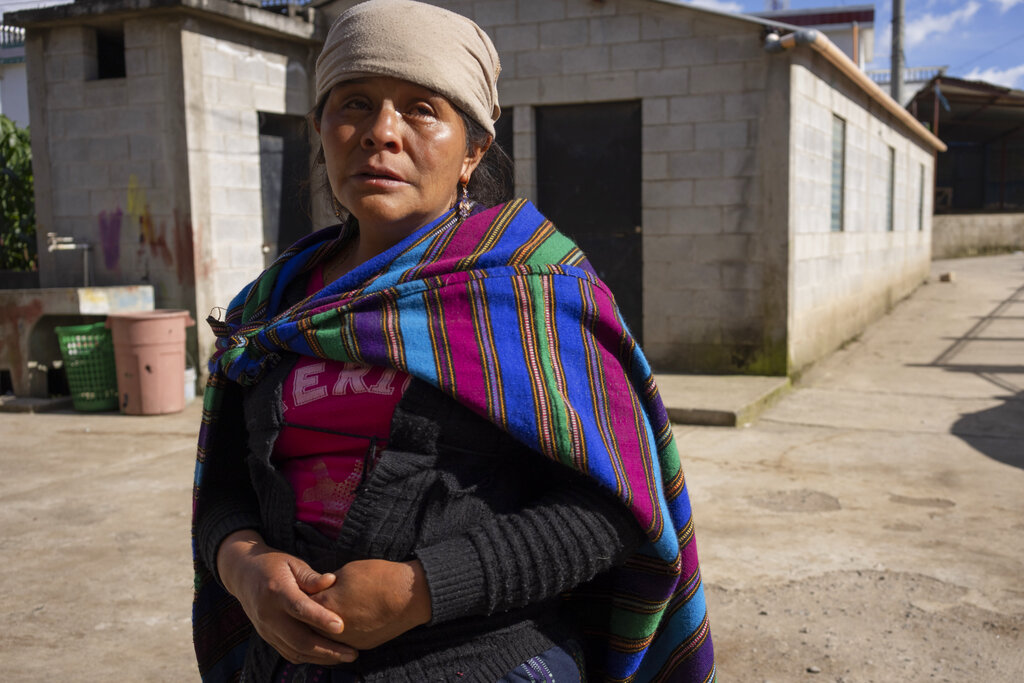 Magdalena Tepaz, mother of Wilmer Tulul, waits for the start of a community meeting in Tzucubal, Guatemala, Wednesday, June 29, 2022. Wilmer and his cousin Pascual Melvin Guachiac, both 13, were among the dead discovered inside a tractor-trailer near auto salvage yards on the edge of San Antonio, Texas, on Monday, in what is believed to be the nation's deadliest smuggling episode on the U.S.-Mexico border. (AP Photo/Moises Castillo)