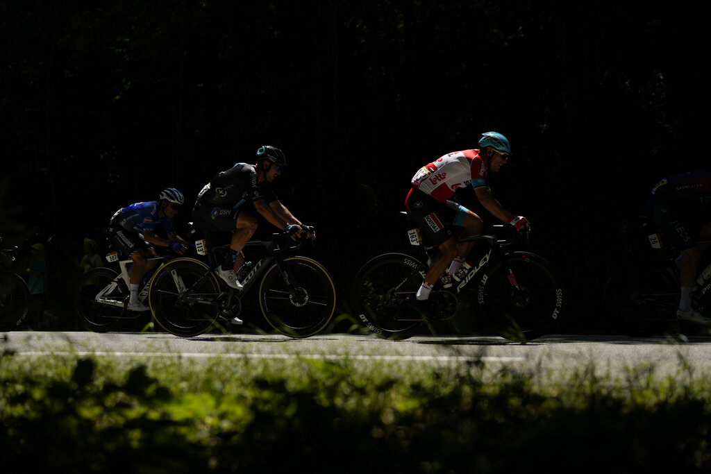Belgium's Philippe Gilbert, right, Germany's John Degenkolb, center, and Italy's Kristian Sbaragli, left, ride during the thirteenth stage of the Tour de France cycling race over 193 kilometers (119.9 miles) with start in Le Bourg d'Oisans and finish in Saint-Etienne, France, Friday, July 15, 2022. (AP Photo/Thibault Camus)