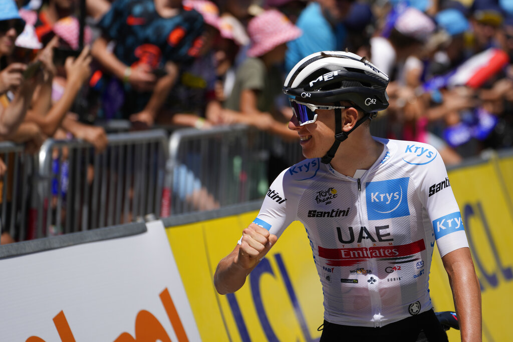 Slovenia's Tadej Pogacar, wearing the best young rider's white jersey, greets fans prior to the thirteenth stage of the Tour de France cycling race over 193 kilometers (119.9 miles) with start in Le Bourg d'Oisans and finish in Saint-Etienne, France, Friday, July 15, 2022. (AP Photo/Thibault Camus)