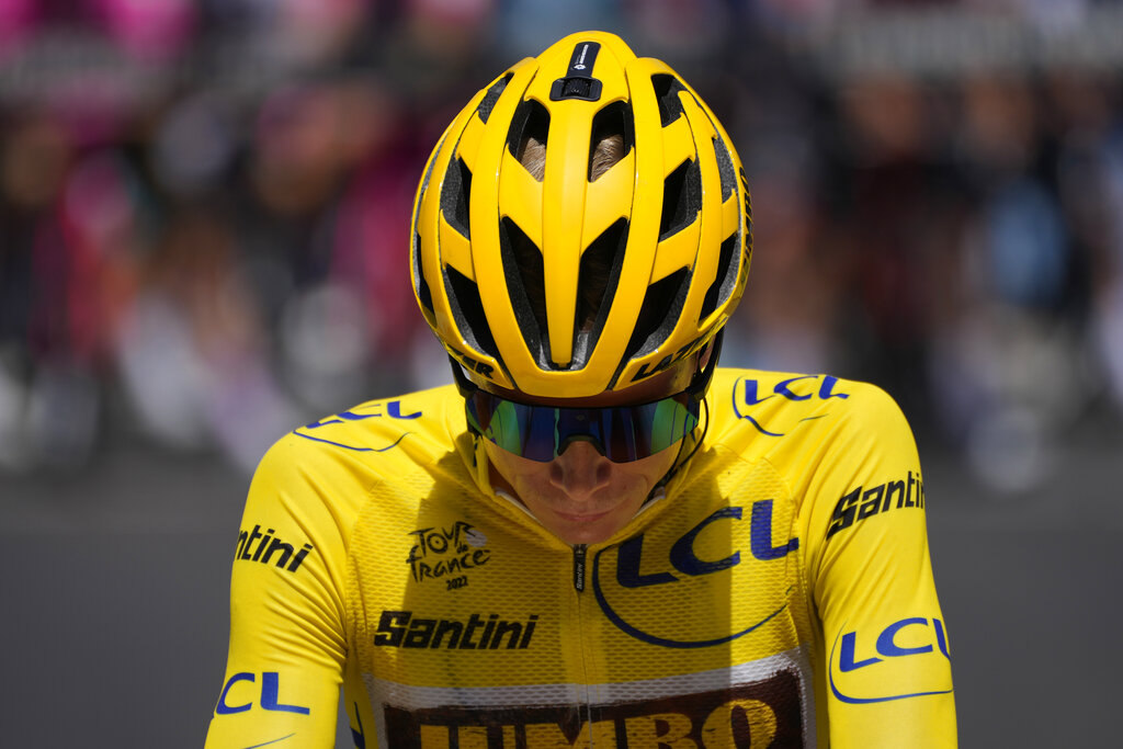 Denmark's Jonas Vingegaard, wearing the overall leader's yellow jersey, waits for the start of the thirteenth stage of the Tour de France cycling race over 193 kilometers (119.9 miles) with start in Le Bourg d'Oisans and finish in Saint-Etienne, France, Friday, July 15, 2022. (AP Photo/Thibault Camus)