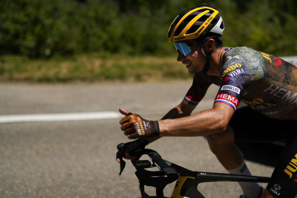 Slovenia's Primoz Roglic flashes a thumbs up during the thirteenth stage of the Tour de France cycling race over 193 kilometers (119.9 miles) with start in Le Bourg d'Oisans and finish in Saint-Etienne, France, Friday, July 15, 2022. (AP Photo/Thibault Camus)