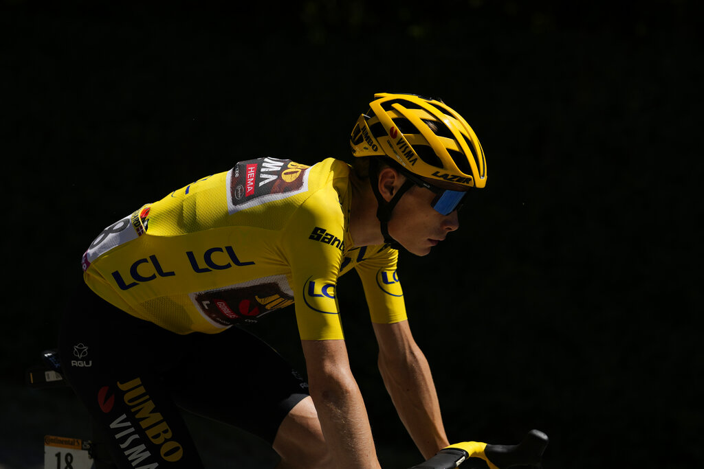 Denmark's Jonas Vingegaard, wearing the overall leader's yellow jersey, rides during the thirteenth stage of the Tour de France cycling race over 193 kilometers (119.9 miles) with start in Le Bourg d'Oisans and finish in Saint-Etienne, France, Friday, July 15, 2022. (AP Photo/Thibault Camus)