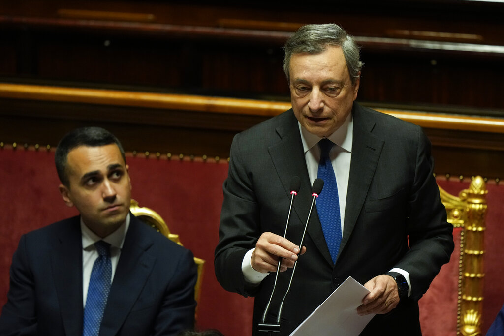 Italian Premier Mario Draghi, right, flanked by Foreign Minister Luigi DI Maio delivers his speech at the Senate in Rome, Wednesday, July 20, 2022. Draghi was deciding Wednesday whether to confirm his resignation or reconsider appeals to rebuild his parliamentary majority after the populist 5-Star Movement triggered a crisis in the government by withholding its support. (AP Photo/Andrew Medichini)