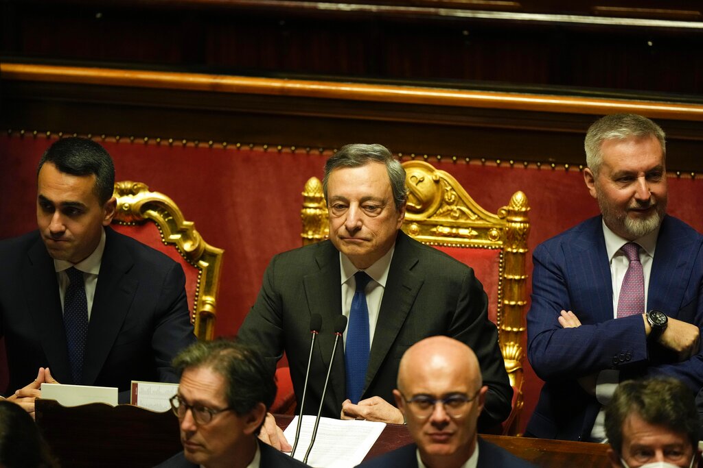 Italian Premier Mario Draghi, center, waits to deliver his speech at the Senate in Rome, Wednesday, July 20, 2022. Draghi was deciding Wednesday whether to confirm his resignation or reconsider appeals to rebuild his parliamentary majority after the populist 5-Star Movement triggered a crisis in the government by withholding its support. (AP Photo/Andrew Medichini)
