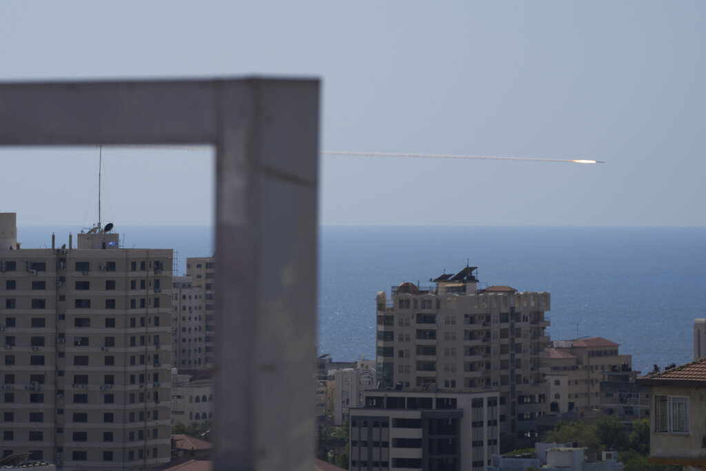 A rocket is launched from the Gaza Strip towards Israel, in Gaza City, Sunday, Aug. 7, 2022. (AP Photo/Hatem Moussa)