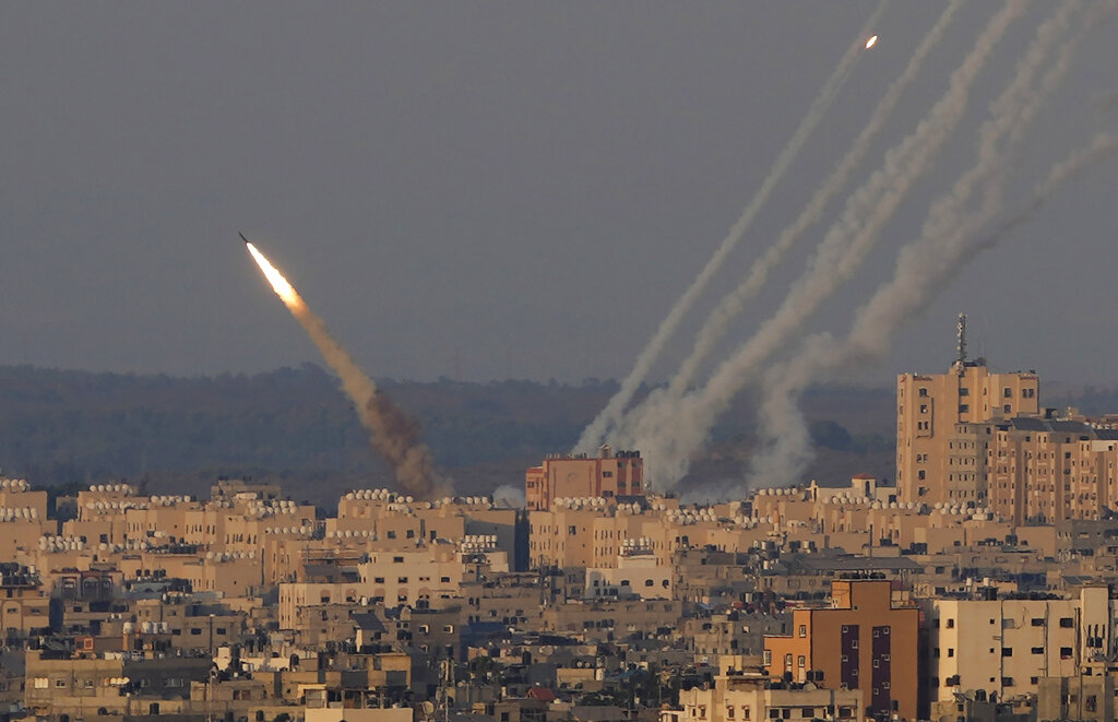 Rockets are launched from the Gaza Strip towards Israel, in Gaza City, Sunday, Aug. 7, 2022. (AP Photo/Hatem Moussa)