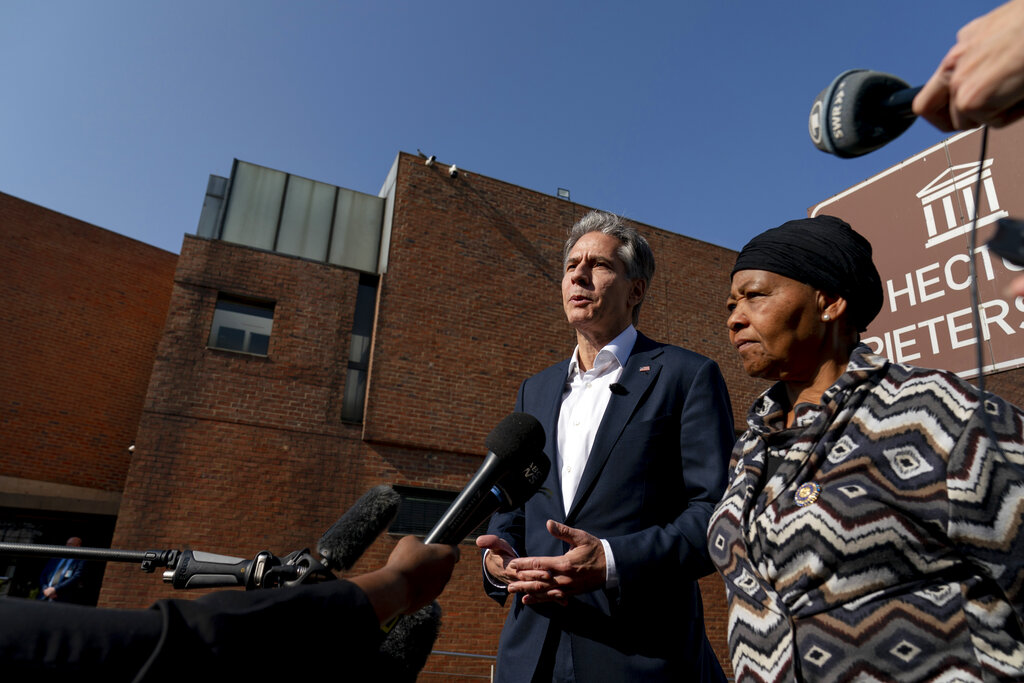 Secretary of State Antony Blinken, accompanied by Antoinette Sithole, the sister of the late Hector Pieterson, right, speak to members of the media after touring the Hector Pieterson Memorial in Soweto, South Africa, Sunday, Aug. 7, 2022. Peaceful child protesters were gunned down by police 30 years ago in an attack that awakened the world to the brutality of the apartheid regime. (AP Photo/Andrew Harnik, Pool)