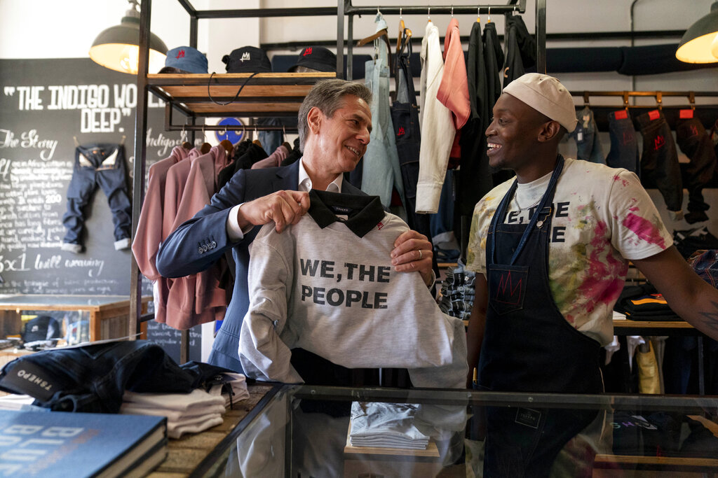Secretary of State Antony Blinken speaks with jeans designer Tshepo he tours the Victoria Yards neighborhood in Johannesburg, South Africa, Sunday, Aug. 7, 2022. Blinken is on a ten day trip to Cambodia, Philippines, South Africa, Congo, and Rwanda. (AP Photo/Andrew Harnik, Pool)