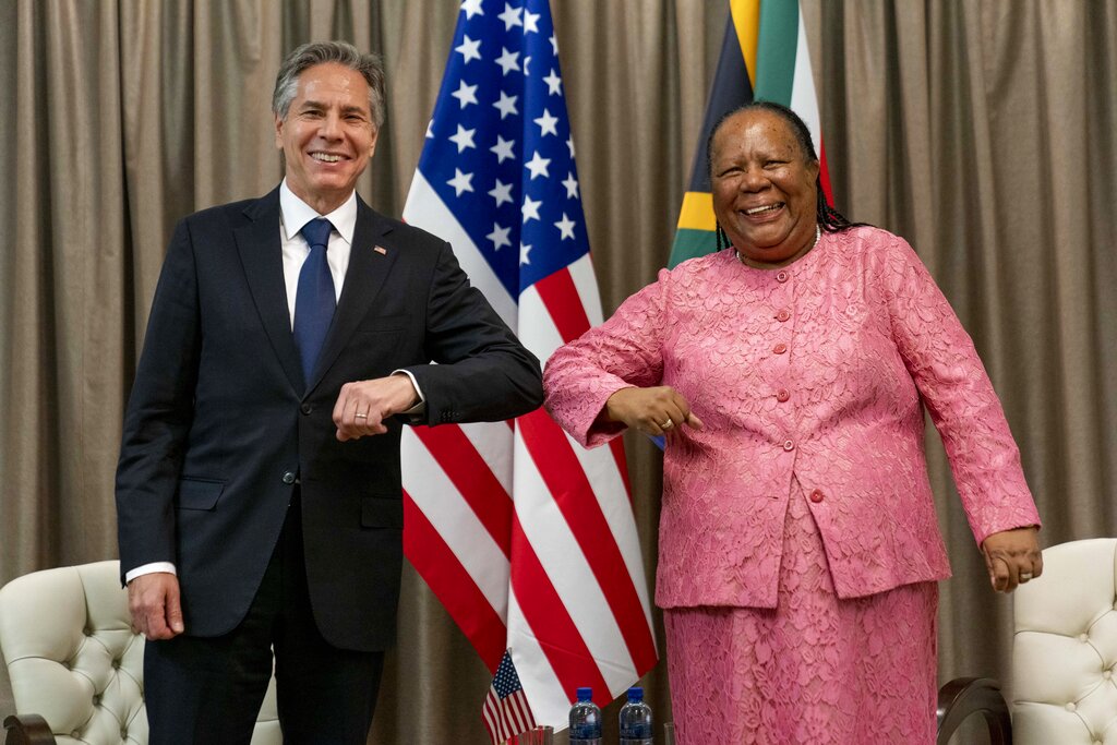 Secretary of State Antony Blinken is greeted by South Africa's Foreign Minister Naledi Pandor as he arrives for a meeting at the South African Department of International Relations and Cooperation in Pretoria, South Africa, Monday, Aug. 8, 2022. Blinken is on a ten day trip to Cambodia, Philippines, South Africa, Congo, and Rwanda. (AP Photo/Andrew Harnik, Pool)