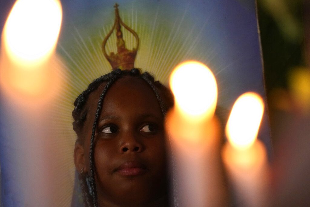 A girl, member of the Kalunga quilombo, descendants of runaway slaves, attends the coronation of the Emperor of the Holy Spirit, during the culmination of the week-long pilgrimage and celebration for the patron saint 