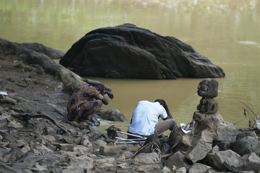 Worshippers of the Osun River goddess pray in Osogbo, Nigeria, on Monday, May 30, 2022. (AP Photo/Sunday Alamba)