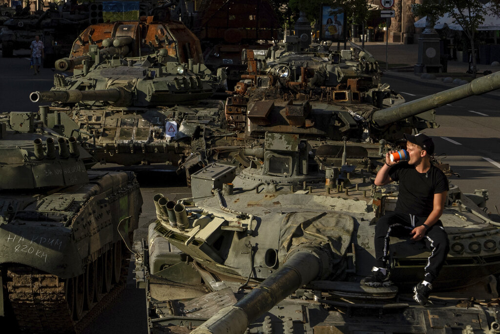 Destroyed Russian military vehicles installed in downtown Kyiv, Ukraine, Wednesday, Aug. 24, 2022. Kyiv authorities have banned mass gatherings in the capital through Thursday for fear of Russian missile attacks. Independence Day, like the six-month mark in the war, falls on Wednesday. (AP Photo/Evgeniy Maloletka)