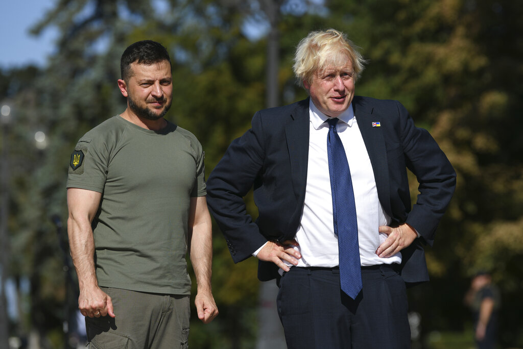 Ukrainian President Volodymyr Zelenskyy, left, and Britain's Prime Minister Boris Johnson during their meeting in Kyiv, Ukraine, Wednesday, Aug. 24, 2022. British prime minister Boris Johnson urged western allies to maintain their strong support to Ukraine through the winter arguing that their position would improve after the cold weather ends. (AP Photo/Andrew Kravchenko)