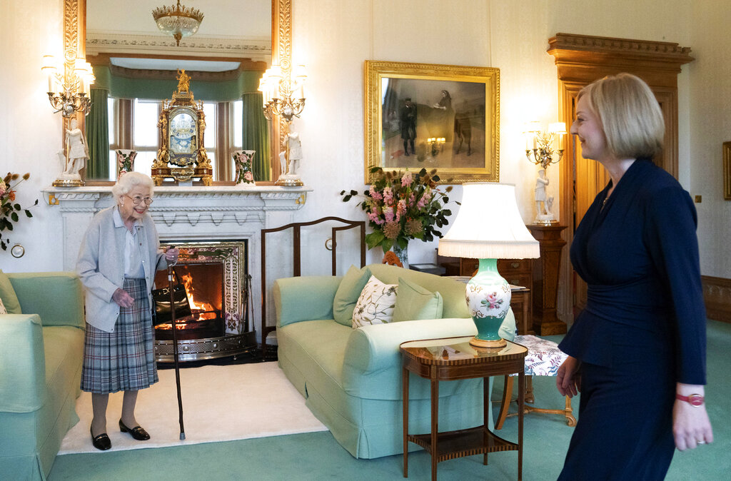 FILE - Britain's Queen Elizabeth II, left, smiles at Liz Truss during an audience at Balmoral, Scotland, where she invited the newly elected leader of the Conservative party to become Prime Minister and form a new government, Tuesday, Sept. 6, 2022. Queen Elizabeth II, Britain's longest-reigning monarch and a rock of stability across much of a turbulent century, died Thursday after 70 years on the throne. She was 96. (Jane Barlow/Pool Photo via AP, File)