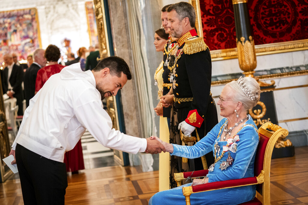 Danish Queen Margrethe welcomes Mute B. Egede, prime minister of Greenland at the gala banquet at Christiansborg Palace in Copenhagen Sunday, Sept. 11, 2022. Scaled-down celebrations took place Sunday in Denmark marking 50 years on the throne by Queen Margrethe, whose reign is now Europe’s longest following the death of Britain’s Queen Elizabeth II. (Ida Marie Odgaard/Ritzau Scanpix via AP)