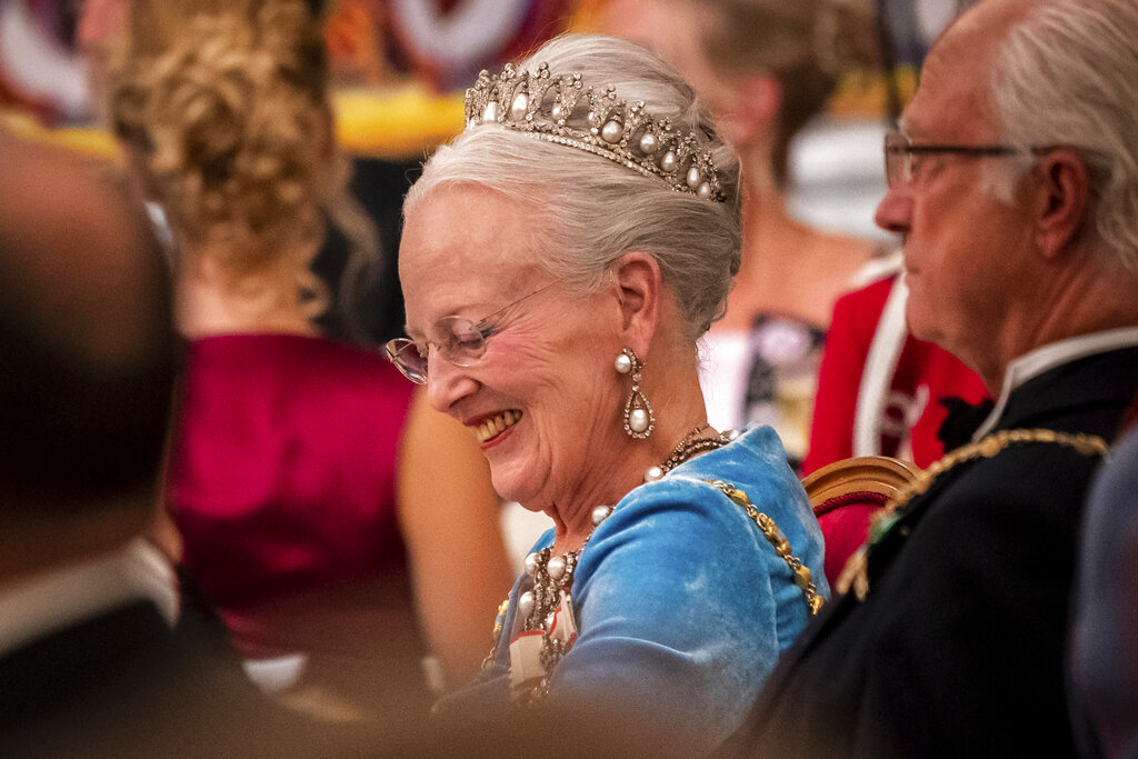 Danish Queen Margrethe listens while Danish Prime Minister Mette Frederiksen gives her speech at the gala banquet at Christiansborg Palace in Copenhagen Sunday, Sept. 11, 2022. Scaled-down celebrations took place Sunday in Denmark marking 50 years on the throne by Queen Margrethe, whose reign is now Europe’s longest following the death of Britain’s Queen Elizabeth II. (Ida Marie Odgaard/Ritzau Scanpix via AP)