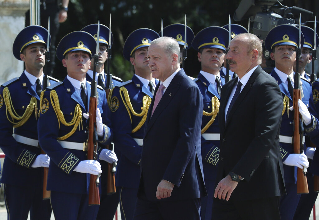 Azerbaijani President Ilham Aliyev, right, and Turkey's President Recep Tayyip Erdogan, review a military honour guard in Shusha, in Nagorno-Karabakh, Azerbaijan, Tuesday, June 15, 2021. Shusha, a culturally revered city that Azerbaijan liberated from Armenian forces in last autumn's war. Shusha, a center of Azerbaijani Turkish culture for centuries, came under Armenian control in 1992 in fighting over the separatist Nagorno-Karabakh region.(Turkish Presidency via AP, Pool)