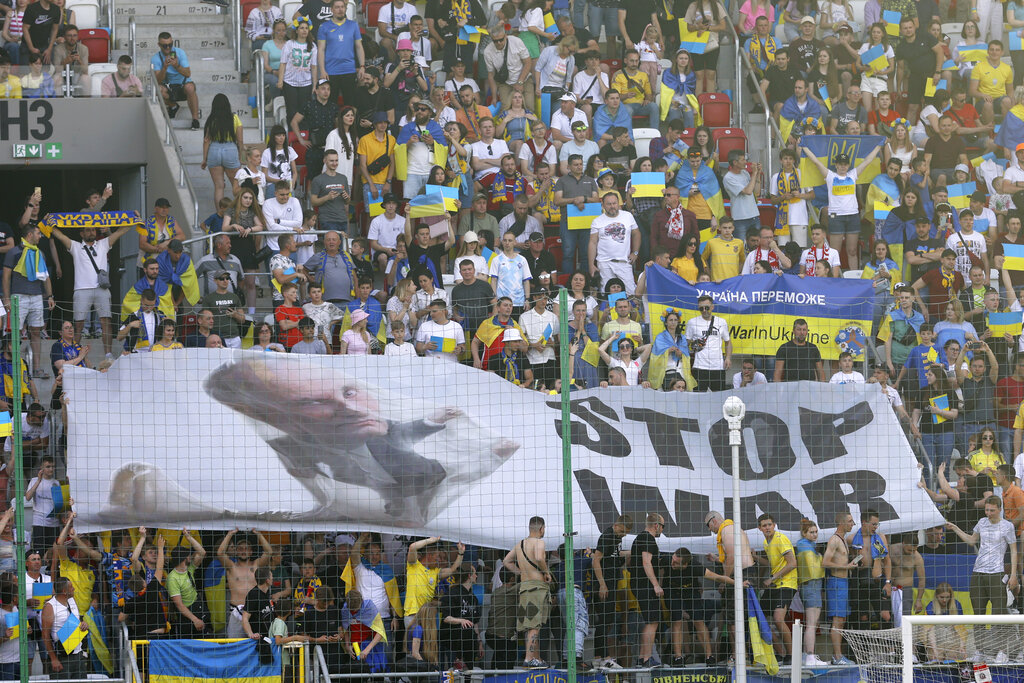 Ukraine supporters unfurl a 