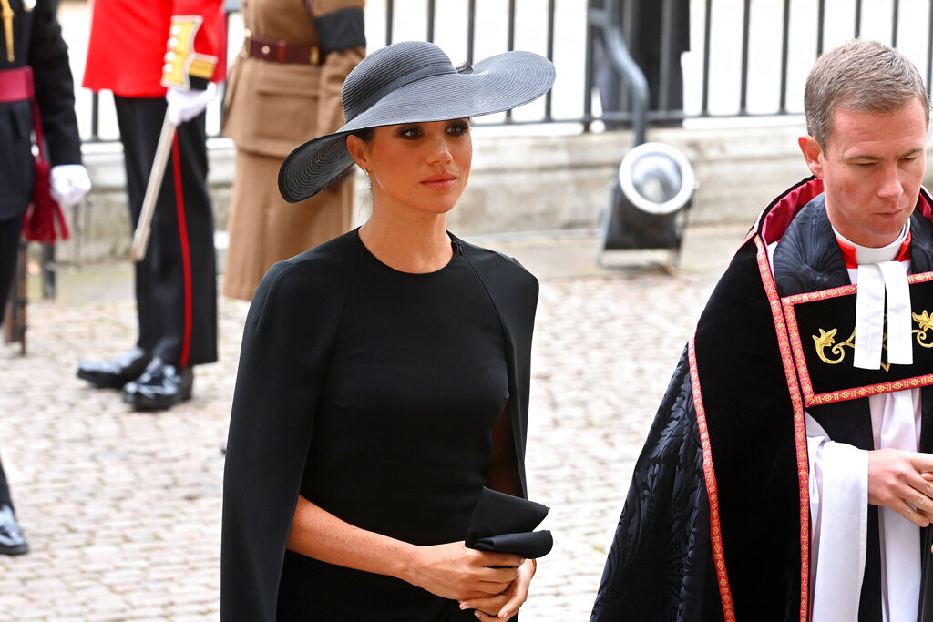 Meghan, Duchess of Sussex arrives for the funeral service of Queen Elizabeth II at Westminster Abbey in central London, Monday Sept. 19, 2022. The Queen, who died aged 96 on Sept. 8, will be buried at Windsor alongside her late husband, Prince Philip, who died last year. (Geoff Pugh/Pool via AP)
