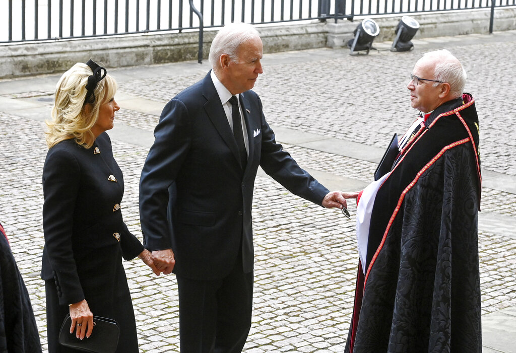 US President Joe Biden and First Lady Jill Biden arrive for the funeral service of Queen Elizabeth II at Westminster Abbey in central London, Monday Sept. 19, 2022. The Queen, who died aged 96 on Sept. 8, will be buried at Windsor alongside her late husband, Prince Philip, who died last year. (Geoff Pugh/Pool via AP)
