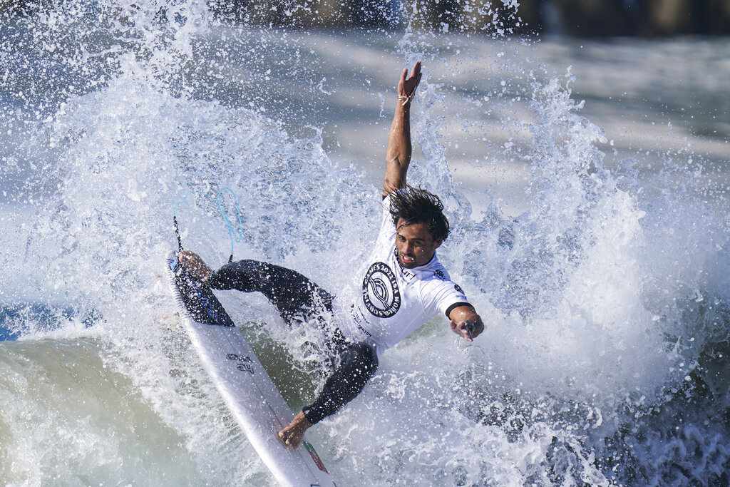 Guilherme Fonseca, of Portugal, competes during the ISA World Surfing Games in Huntington Beach, Calif., Tuesday, Sept. 20, 2022. (AP Photo/Jae C. Hong)