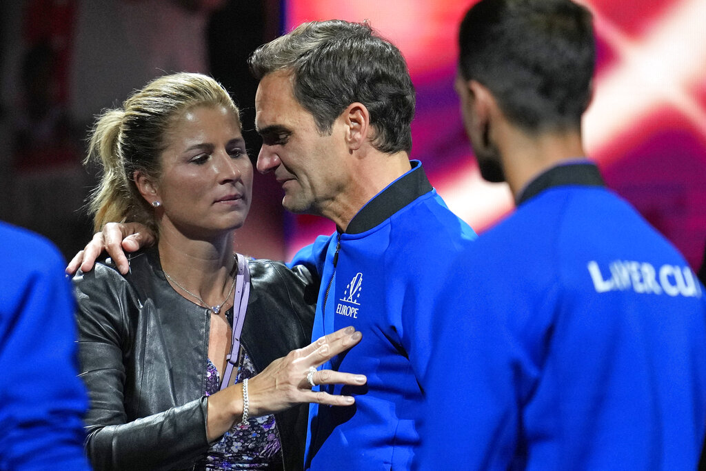 An emotional Roger Federer of Team Europe is embraced by his wife Mirka after playing with Rafael Nadal in a Laver Cup doubles match against Team World's Jack Sock and Frances Tiafoe at the O2 arena in London, Friday, Sept. 23, 2022. Federer's losing doubles match with Nadal marked the end of an illustrious career that included 20 Grand Slam titles and a role as a statesman for tennis. (AP Photo/Kin Cheung)