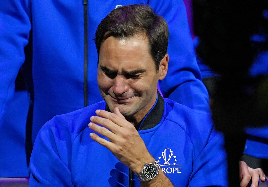 An emotional Roger Federer of Team Europe sits alongside his playing partner Rafael Nadal after their Laver Cup doubles match against Team World's Jack Sock and Frances Tiafoe at the O2 arena in London, Friday, Sept. 23, 2022. Federer's losing doubles match with Nadal marked the end of an illustrious career that included 20 Grand Slam titles and a role as a statesman for tennis. (AP Photo/Kin Cheung)