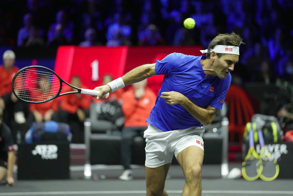 Team Europe's Roger Federer, ducks under a ball that was returned to him as he plays with Rafael Nadal during their Laver Cup doubles match against Team World's Jack Sock and Frances Tiafoe at the O2 arena in London, Friday, Sept. 23, 2022. (AP Photo/Kin Cheung)
