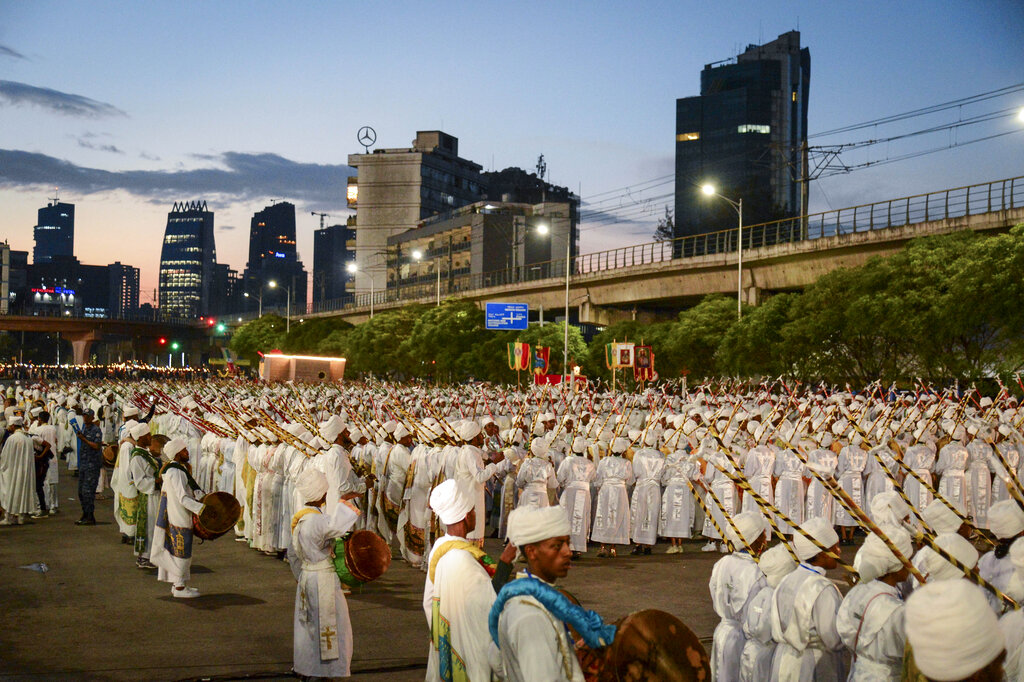 Ethiopian Orthodox Christians beat drums and sing to celebrate the eve of the holiday of Meskel in Addis Ababa, Ethiopia Monday, Sept. 26, 2022. The festival commemorates the unearthing of the 