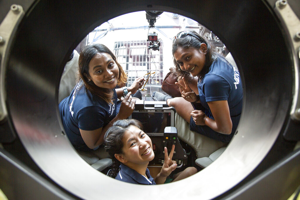 IMAGE DISTRIBUTED FOR NEKTON - Two scientists from the Maldives and their American submersible pilot make history by being the first people from the Indian Ocean nation to dive into the twilight zone. Shafiya Naeem left and Farah Amjad right, were piloted to 250m by Kimly Do centre aboard the three person Omega Seamaster II submersible on Sunday 11th September 2022 at Laamu Atoll, Maldives. The trio are part of the Nekton Maldives Mission, a joint initiative by UK-based Nekton and the Maldives government to map, sample and gather data on ocean health which can inform policy makers both in the Maldives and beyond, as the climate crisis deepens. HANDOUT IMAGE - Please see special instructions. MANDATORY CREDIT - 