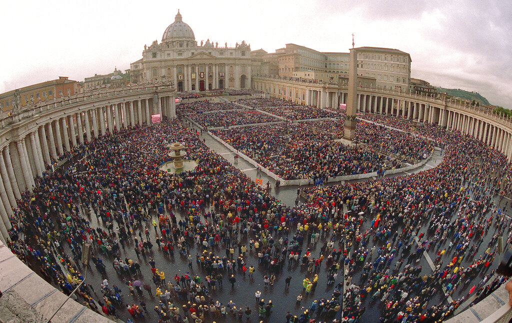 A view of St. Peter's Square at the Vatican, during a canonization ceremony led by Pope John Paul II,  Sunday October 1, 2000.  The pontiff added the first Chinese Catholics to the growing roll of saints Sunday, declaring 120 Chinese Catholics and foreign missionaries martyrs in the church's five-century and on-going struggle in China.  China's state-run  church bitterly protested the canonization which fell on China's national day, celebrating the 51st anniversary of communist rule. U.S socialite and philantropist Katharine Drexel was also canonized Sunday with Sudanese slave-turned-nun Giuseppina Bakhita and Spaniard Maria Josefa del Corazon de Jesus Sancho de Guerra, founder of a charitable order.  Pope John Paul has created 447 saints in his 22-year papacy.   (AP Photo/Massimo Sambucetti)