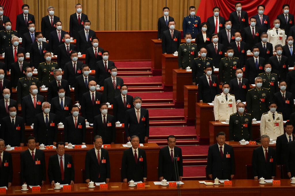 Chinese President Xi Jinping and former President Hu Jintao at right stand as they attend the opening ceremony of the 20th National Congress of China's ruling Communist Party held at the Great Hall of the People in Beijing, China, Sunday, Oct. 16, 2022. China on Sunday opens a twice-a-decade party conference at which leader Xi Jinping is expected to receive a third five-year term that breaks with recent precedent and establishes himself as arguably the most powerful Chinese politician since Mao Zedong. (AP Photo/Mark Schiefelbein)