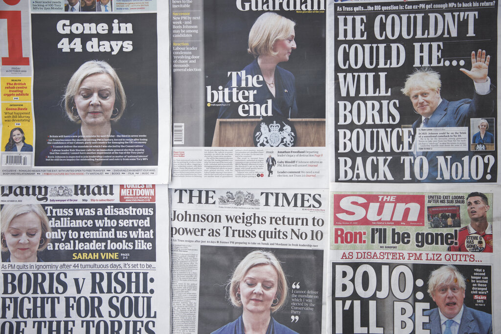 A selection of the front pages of British national newspapers showing the reaction the the resignation of Prime Minister Liz Truss, in central London, Friday, Oct. 21, 2022. British Prime Minister Liz Truss resigned Thursday, bowing to the inevitable after a tumultuous, short-lived term in which her policies triggered turmoil in financial markets and a rebellion in her party that obliterated her authority. (AP Photo/David Cliff)