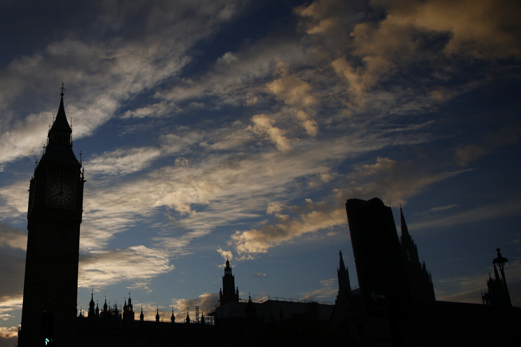 A general view of the Houses of Parliament at sunrise in London, Friday, Oct. 21, 2022. British Prime Minister Liz Truss resigned Thursday, bowing to the inevitable after a tumultuous, short-lived term in which her policies triggered turmoil in financial markets and a rebellion in her party that obliterated her authority. (AP Photo/David Cliff)