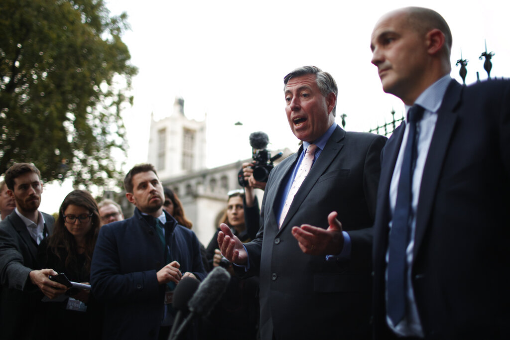 Graham Brady, left, Chairman of the 1922 Committee, and Jake Berry, right, Chairman of the Conservative Party, speak to media outside Parliament in London, Thursday, Oct. 20, 2022. Britain's Prime Minister liz Truss resigned Thursday, bowing to the inevitable after a tumultuous, short-lived term in which her policies triggered turmoil in financial markets and a rebellion in her party that obliterated her authority. (AP Photo/David Cliff)