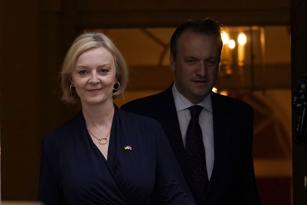 Britain's Prime Minister Liz Truss and husband Hugh O'Leary leave 10 Downing Street to address the media in London, Thursday, Oct. 20, 2022. Truss says she resigns as leader of UK Conservative Party. (AP Photo/Alberto Pezzali)