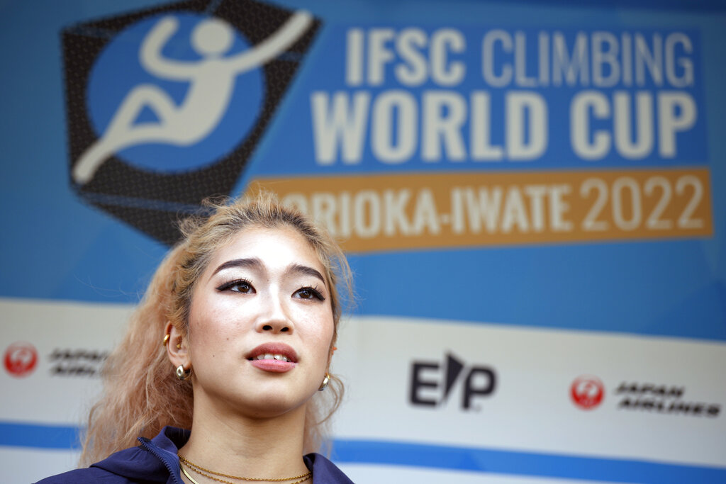 Miho Nonaka of Japan speaks after participating in the women's lead semi-final of the IFSC Climbing World Cup Friday, Oct. 21, 2022, in Morioka, Iwate Prefecture, Japan. After Iranian climber Elnaz Rekabi joined a growing list of female athletes who have been targeted by their governments for defying authoritarian policies or acting out against bullying, a number of others have spoken out on their concerns of politics crossing into their sporting world. (AP Photo/Eugene Hoshiko)