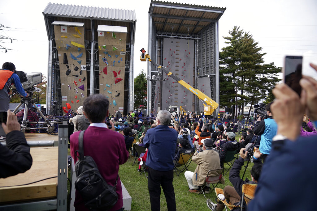 People watch the women's and men's lead semi-final of the IFSC Climbing World Cup Friday, Oct. 21, 2022, in Morioka, Iwate Prefecture, Japan. After Iranian climber Elnaz Rekabi joined a growing list of female athletes who have been targeted by their governments for defying authoritarian policies or acting out against bullying, a number of others have spoken out on their concerns of politics crossing into their sporting world. (AP Photo/Eugene Hoshiko)