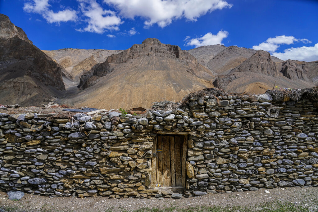 The home of Konchok Dorjey, sits locked in the remote Kharnak village in the cold desert region of Ladakh, India, Saturday, Sept. 17, 2022. Dorjey now lives with his wife, two daughters and a son in Kharnakling, where scores of other nomadic families from his native village have also settled in the last two decades. (AP Photo/Mukhtar Khan)