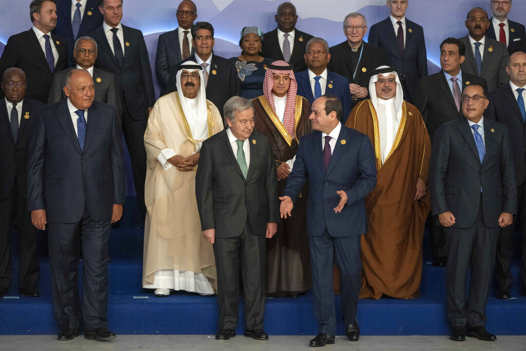 Egyptian President Abdel Fattah El-Sisi, center right, and United Nations Secretary-General Antonio Guterres, center left, leave after a group photo at the COP27 U.N. Climate Summit, in Sharm el-Sheikh, Egypt, Monday, Nov. 7, 2022. (AP Photo/Nariman El-Mofty)