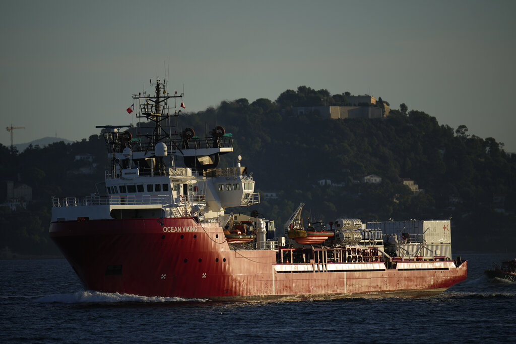 The humanitarian ship the Ocean Viking makes its way into the military base in Toulon, France, Friday, Nov. 11, 2022. The Norwegian-flagged vessel, operated by the NGO SOS Méditerranée, had been at sea for nearly three weeks carrying around 230 migrants. Italy had refused to allow the migrants to disembark on Italian territory. (AP Photo/Daniel Cole)