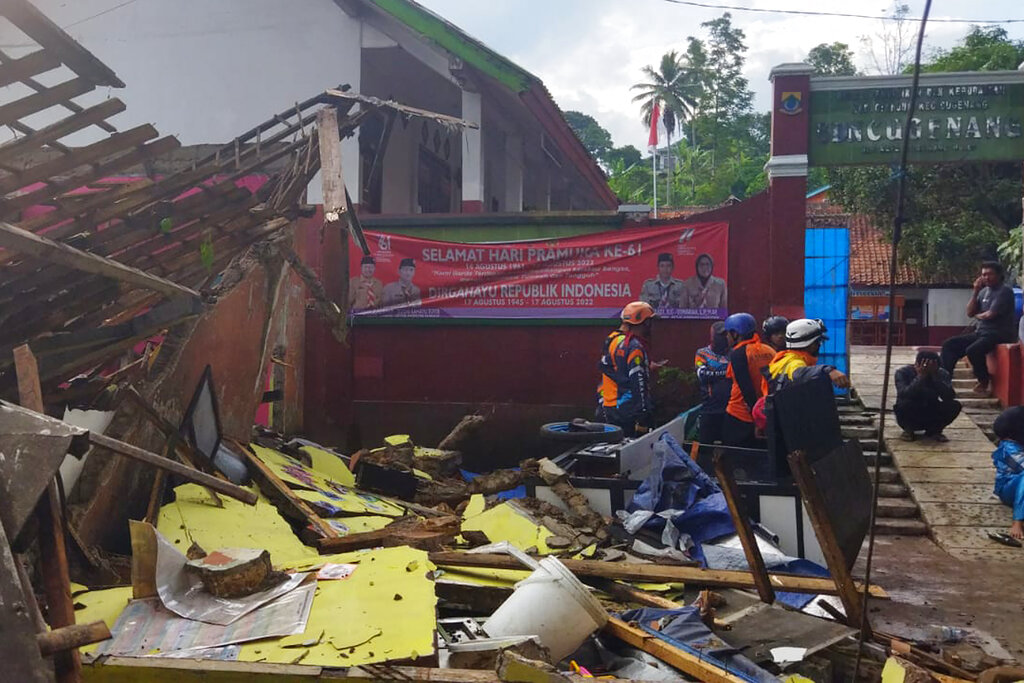 In photo released by Indonesian National Search and Rescue Agency (BASARNAS), rescuers inspect a school damaged by earthquake in Cianjur, West Java, Indonesia, Monday, Nov. 21, 2022. An earthquake shook Indonesia’s main island of Java on Monday, killing a number of people, damaging dozens of buildings and sending residents into the capital's streets for safety. (BASARNAS via AP)