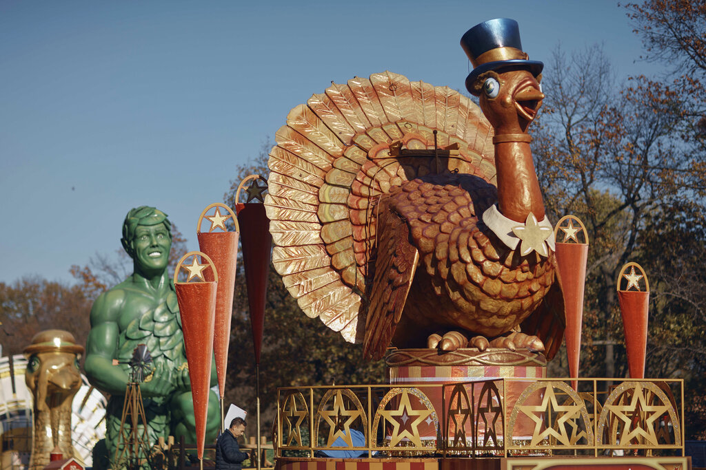 A man inspects a float of Tom Turkey that is lined up for the Macy's Thanksgiving Day Parade on Wednesday, Nov. 23, 2022. Macy's Thanksgiving Day Parade will take place on Thursday. (AP Photo/Andres Kudacki)