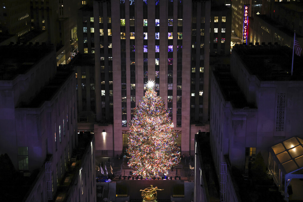 The Rockefeller Center Christmas tree stands illuminated following the 90th annual lighting ceremony, Wednesday, Nov. 30, 2022, in New York. (AP Photo/Julia Nikhinson)