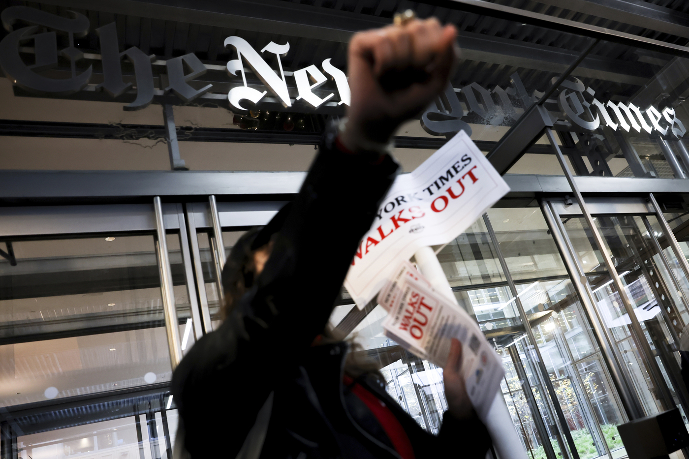 Hundreds of New York Times journalists and other staff protest outside the Times' office after walking off the job for 24 hours, frustrated by contract negotiations that have dragged on for months in the newspaper's biggest labor dispute in more than 40 years, Thursday, Dec. 8, 2022, in New York. (AP Photo/Julia Nikhinson)