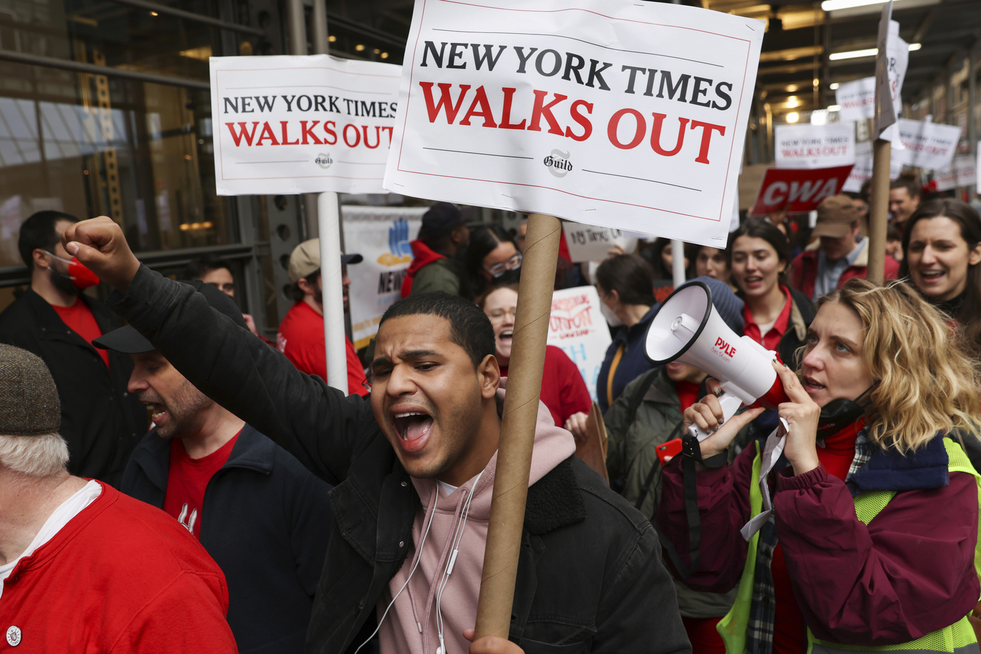 Hundreds of New York Times journalists and other staff picket outside the Times' office after walking off the job for 24 hours, frustrated by contract negotiations that have dragged on for months in the newspaper's biggest labor dispute in more than 40 years, Thursday, Dec. 8, 2022, in New York. (AP Photo/Julia Nikhinson)