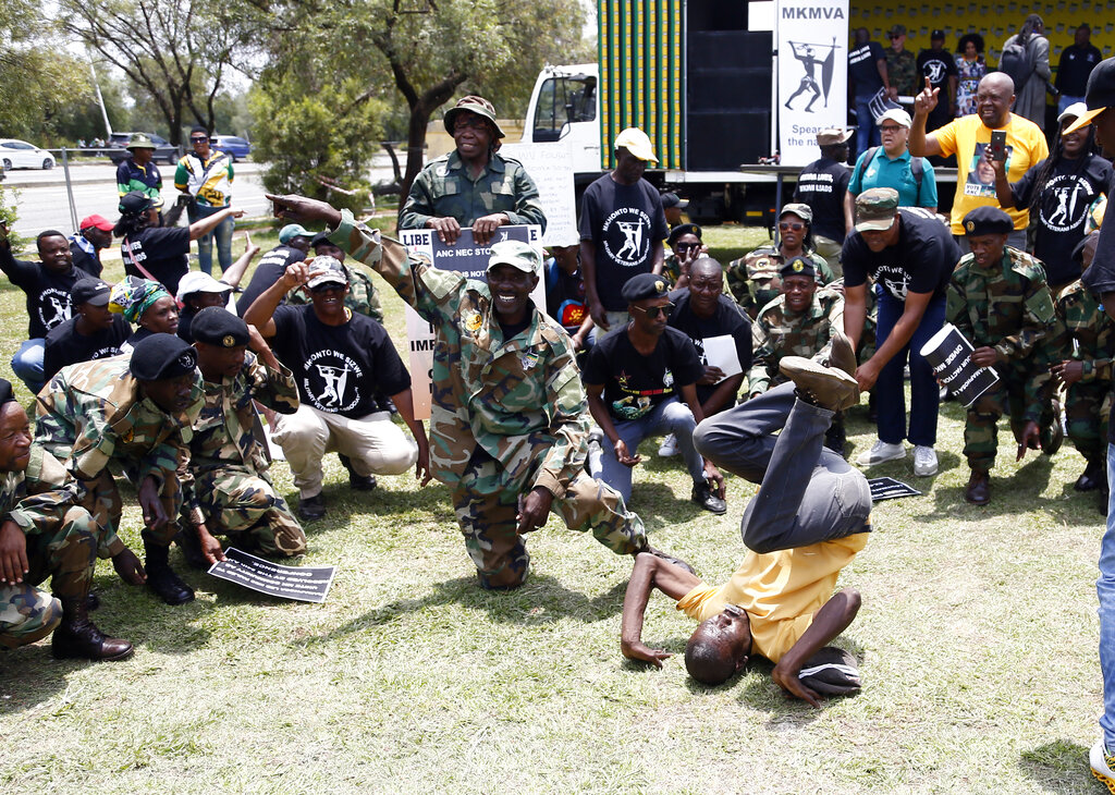 Veterans of the African National Congress (ANC) military wing protest outside the venue of the ANC national conference in Johannesburg, South Africa, Friday, Dec. 16, 2022. The conference will elect the party's leadership and adopt key policies for governing the country. President Cyril Ramaphosa is seeking re-election as the party's leader at the national conference which is held every five years and is the ANC's highest decision-making body. (AP Photo)