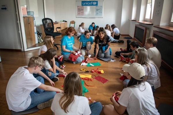 On 2 August 2022, UNICEF Goodwill Ambassador Priyanka Chopra Jonas visits a summer camp in Warsaw, Poland. 

The idea behind the camps, which are implemented in cooperation with Polish municipalities, is to help integrate Ukrainian children into their new environment. By involving them in different activities and exposing them to Polish culture, Ukrainian children will be better prepared for the start of a new school year. 

This summer camp is organized by an NGO partner, Unbreakable Ukraine, and engages 150 children aged 6-14. Children take part in catch-up learning, educational games, skills development activities, Polish language classes, as well as outdoor sports activities. 

The current cohort has started only a couple of days ago, so the children are still getting to know one another and have just started learning Polish language. 

About 600 children are currently in summer camps taking place in Warsaw, Krakow, Wroclaw and Rzeszow

Priyanka Chopra Jonas is visiting Poland in her capacity as a UNICEF Goodwill Ambassador to meet with women and children who have fled Ukraine and to witness first-hand UNICEF’s response in providing services and support that keep children learning, healthy and safe, and help them handle the potentially distressing experiences they have been through as a result of the war. UNICEF’s principal focus in Poland is on expanding opportunities for education – formal and informal – for up to 500,000 children, because the chance to learn in a safe space, together with friends and teachers, doesn’t just deliver education but also brings a crucial sense of stability, normalcy and hope to war-affected children.