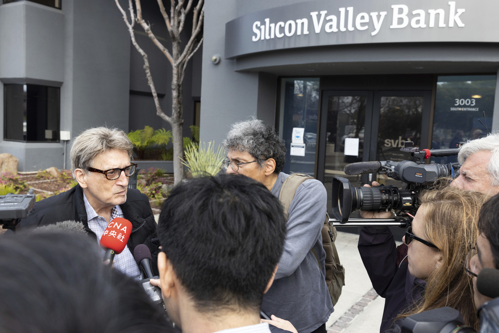 Bob, who did not want to provide a last name speaks with press after exiting Silicon Valley Bank's headquarters in Santa Clara, Calif., on Monday, March 13, 2023. The federal government intervened Sunday to secure funds for depositors to withdraw from Silicon Valley Bank after the bank's collapse. Bob said that he has been a customer of SVB for 25 years and came to the bank to withdraw his money. (AP Photo/Benjamin Fanjoy)